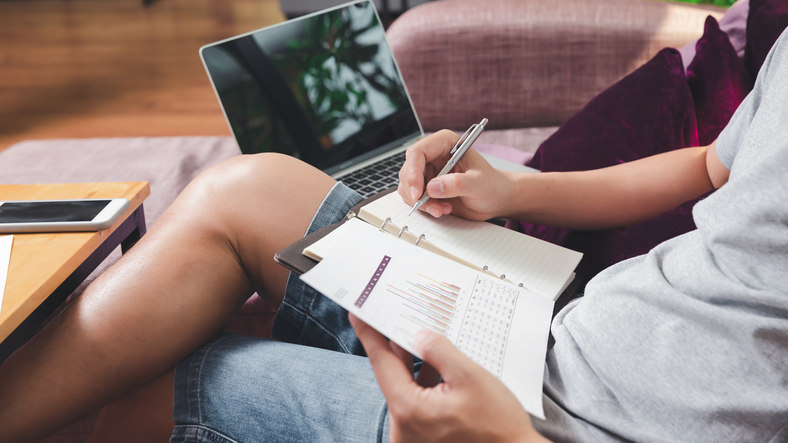 employee-at-home-doing-payroll-by-paper