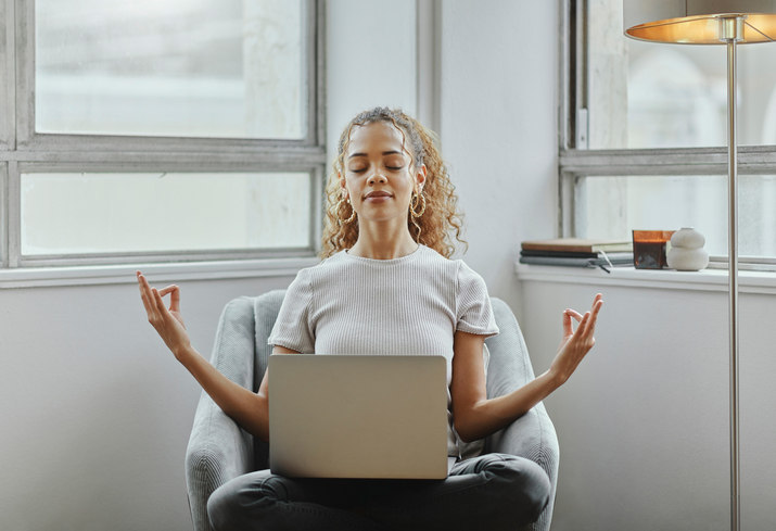 woman-meditating-with-laptop-in-lap