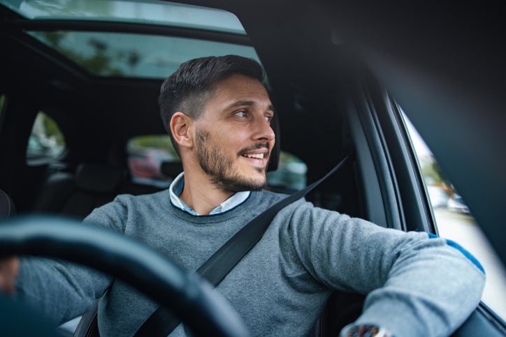 man-driving-car-with-arm-in-window