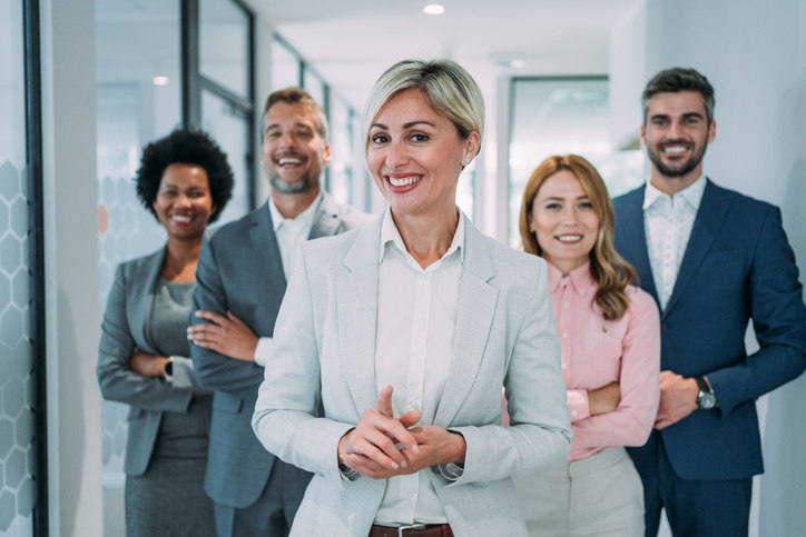 people-standing-in-a-hallway-smiling