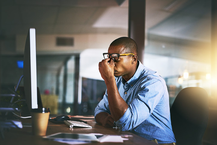 stressed-man-sitting-at-desk