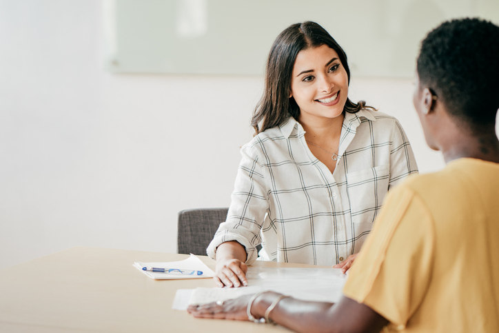 two-women-discussing-payroll